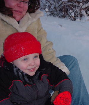 Aunt Gwennie and Frankie sledding